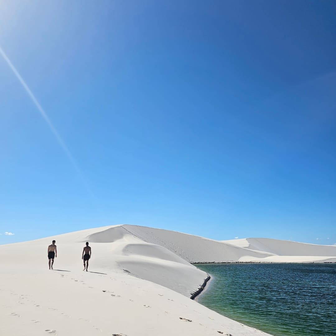 Friends hanging out by the lagoon in Lencois Maranhenses