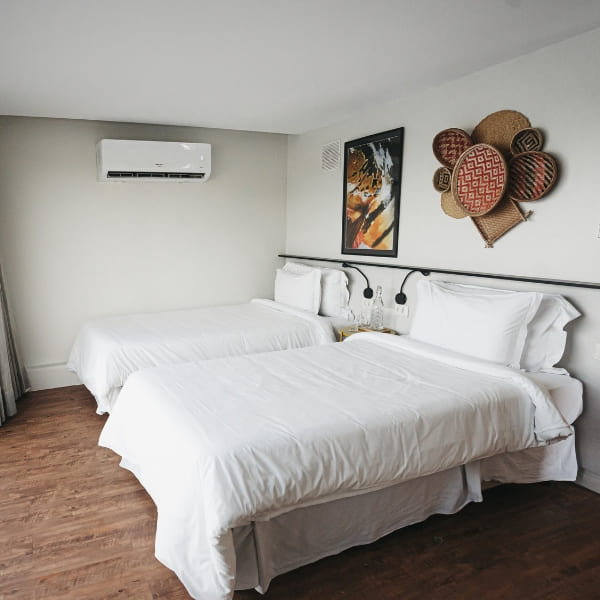 An air-conditioned elegant en-suite cabin with two twin beds and beautiful, sophisticated decor